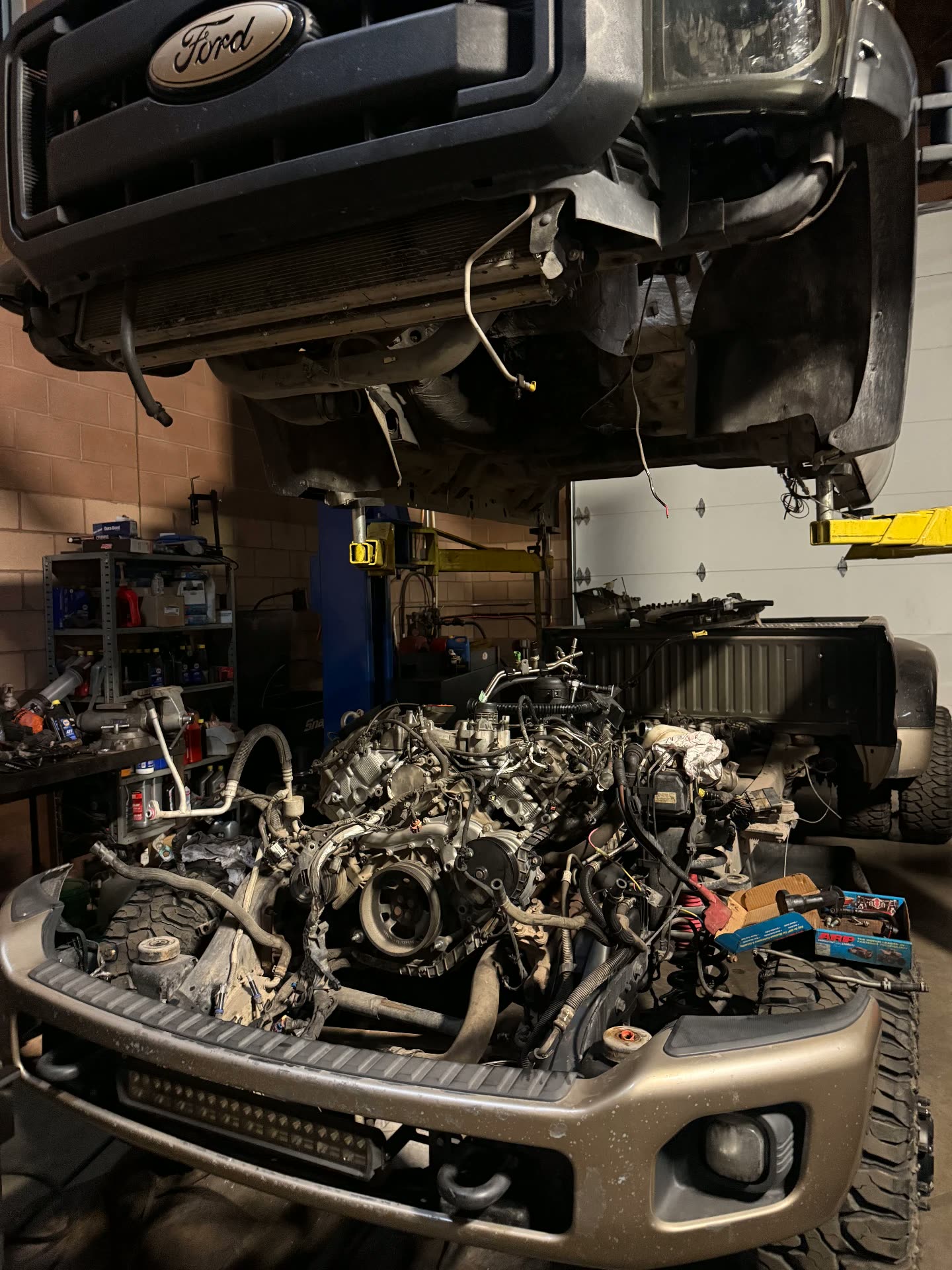 Ford Super Duty diesel engine out of the truck during a rebuild at MPA
