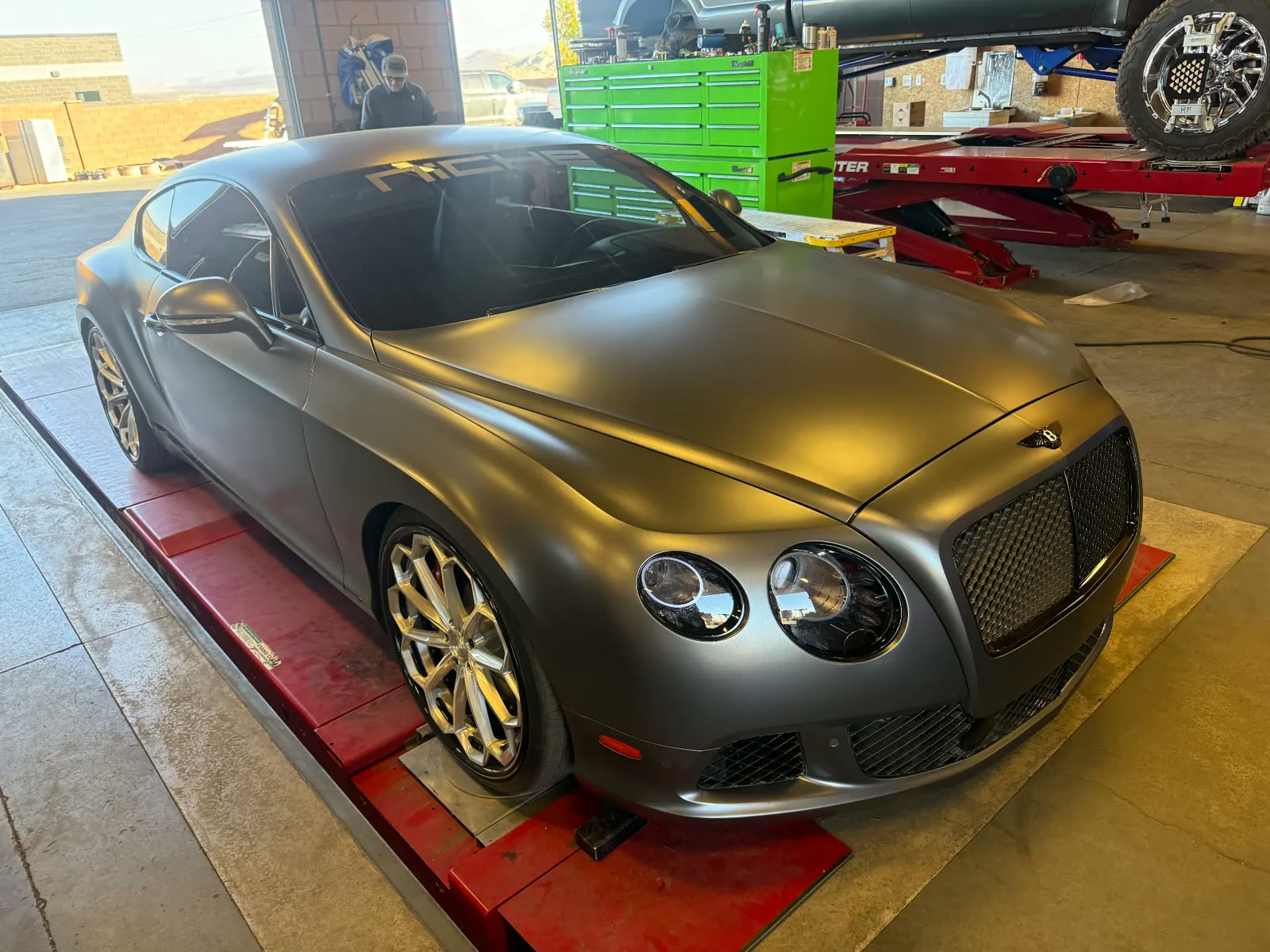 Satin wrapped Bentley Continental GT on the Hunter alignment rack