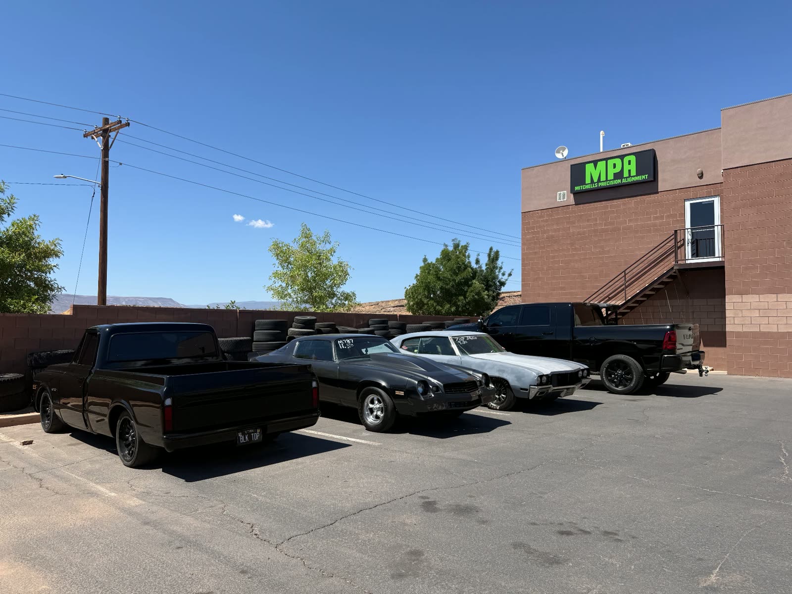 The MPA shop building in St. George, Utah with classic cars parked out front
