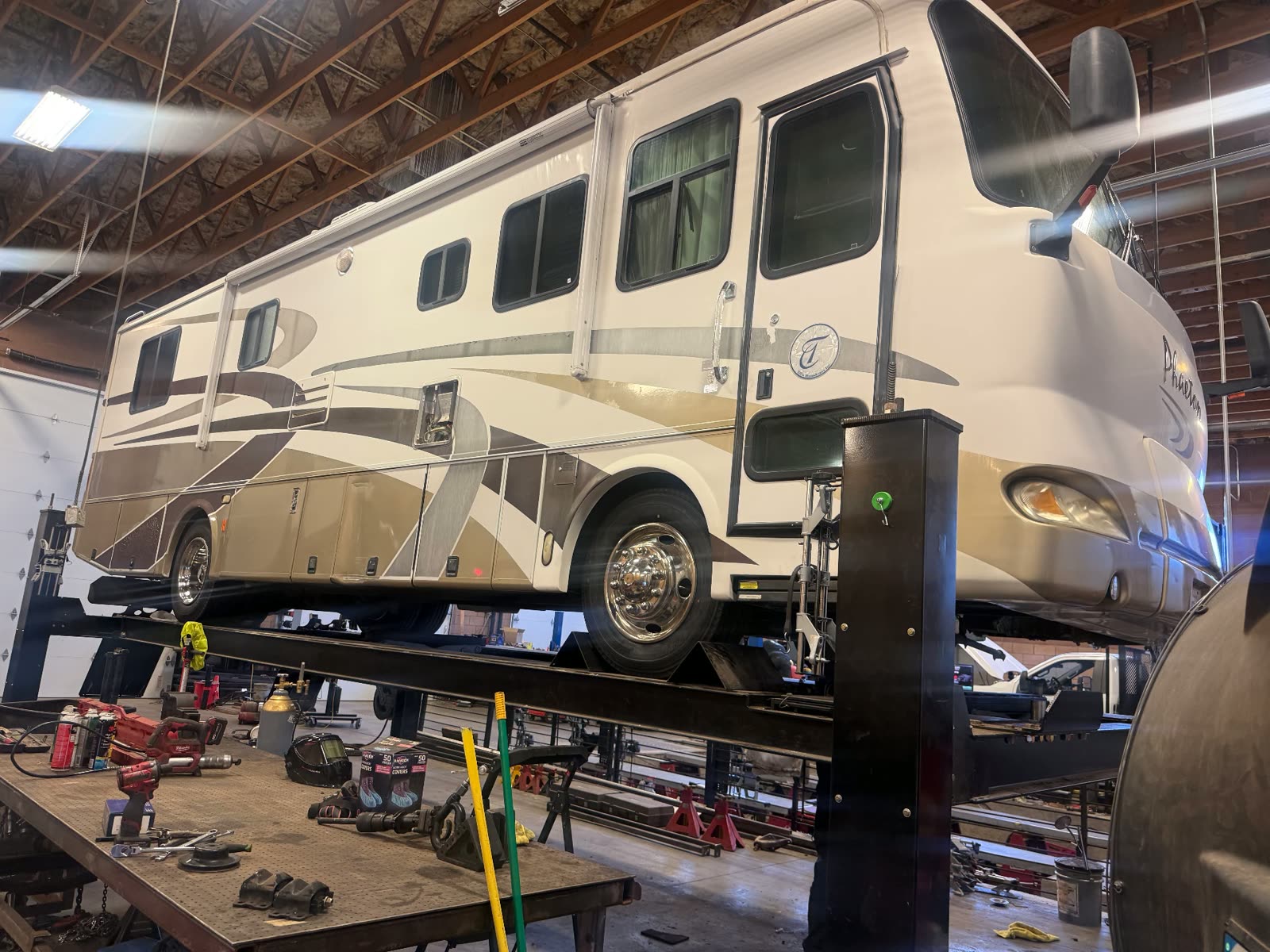Tiffin Phaeton Class A motorhome on the heavy duty alignment rack