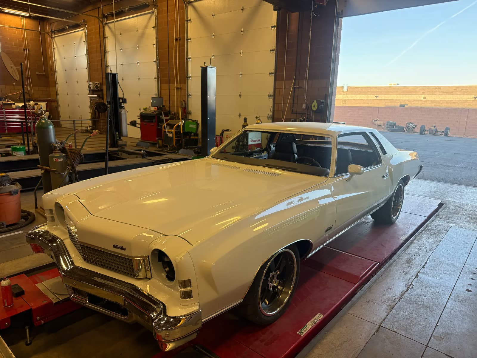 Classic Chevrolet Monte Carlo rolling off the alignment rack