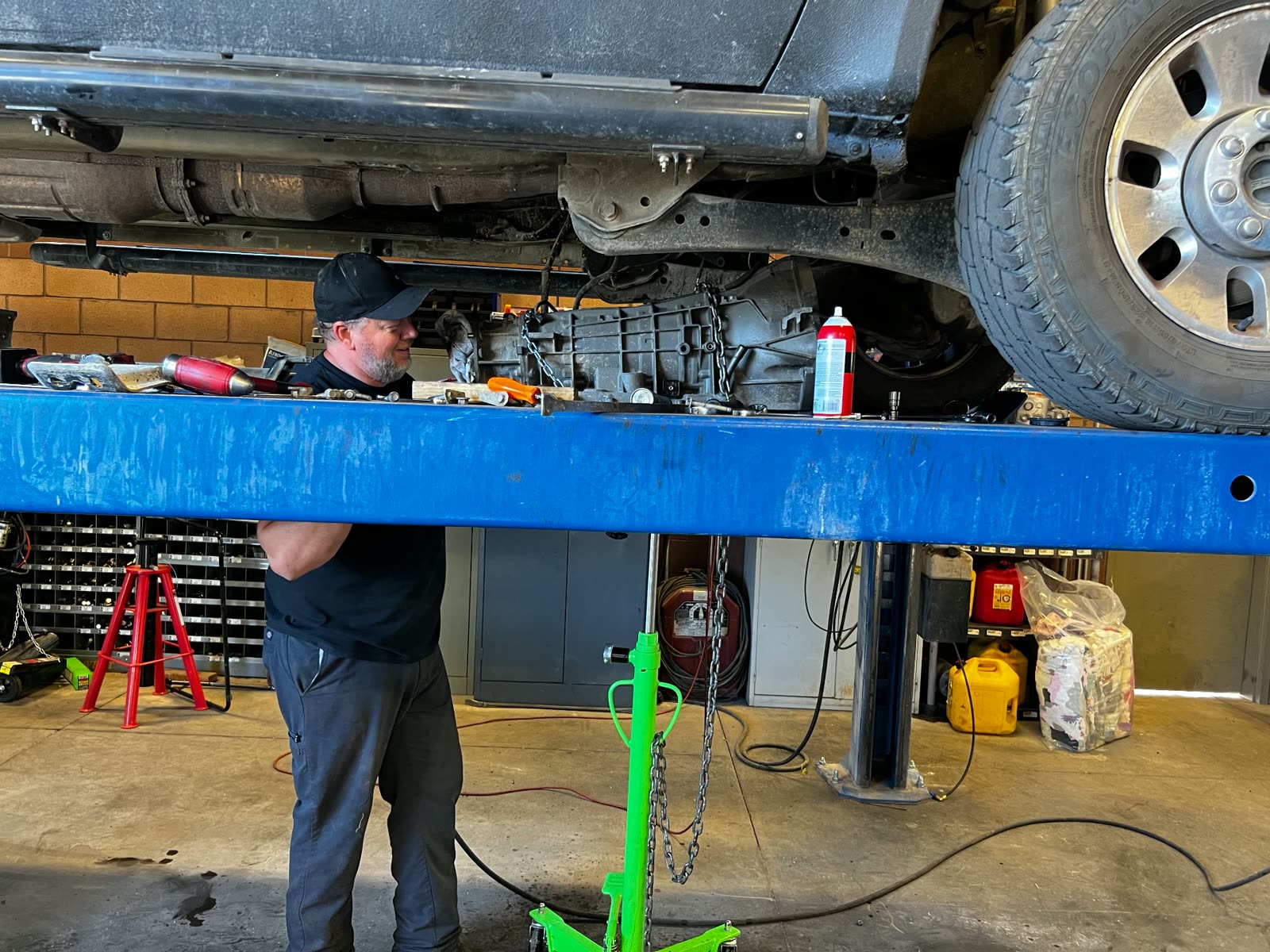 MPA technician dropping a transmission out of a truck on the lift