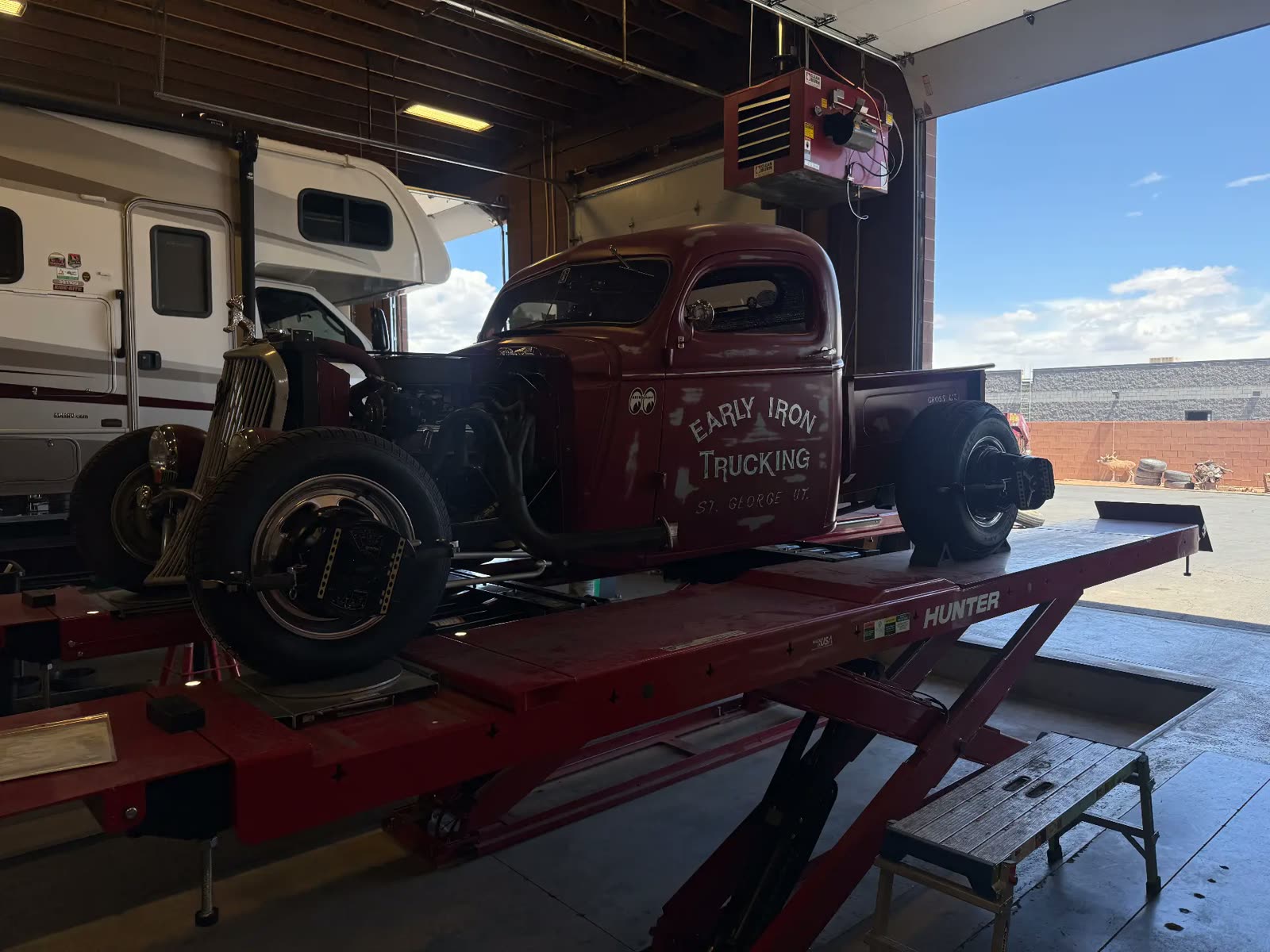 Early Iron Trucking vintage hot rod pickup on the alignment rack